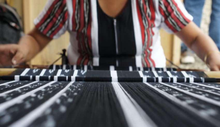 a woman weaving