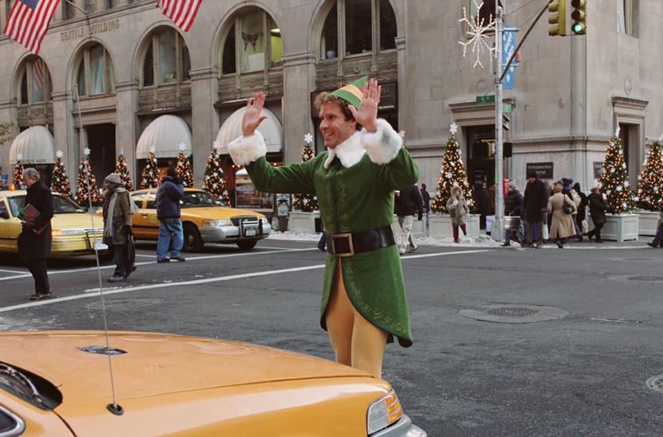 William “Buddy” Hobbs in front of a taxi in New York City.