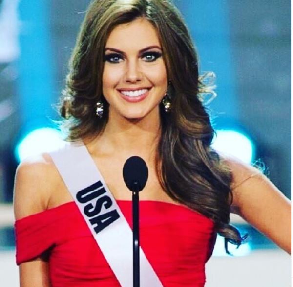 Miss USA Erin Brady is wearing a bright red dress