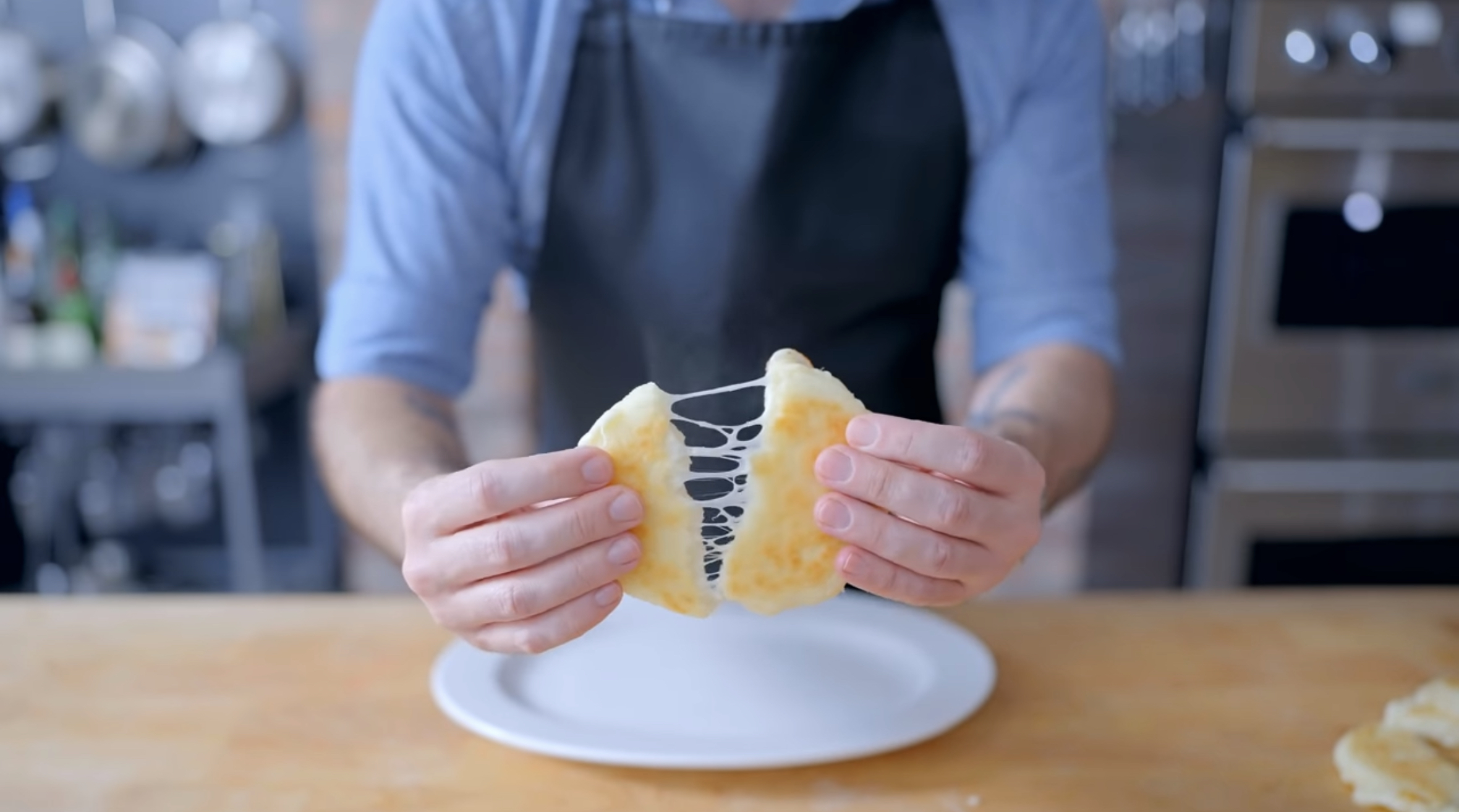Babish halving an Arepas con Queso