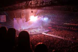 People partying at a live concert. Photo by Chaz McGregor. Via Unsplash.com