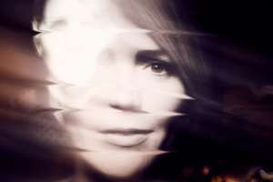 Woman’s face distorted. Photo by Darius Bashar via Unsplash