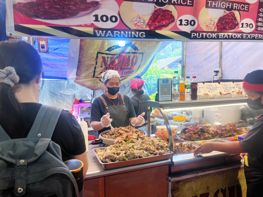 A bustling food stall in an expo