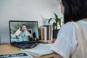 A Girl Sitting at the Table via Pexels